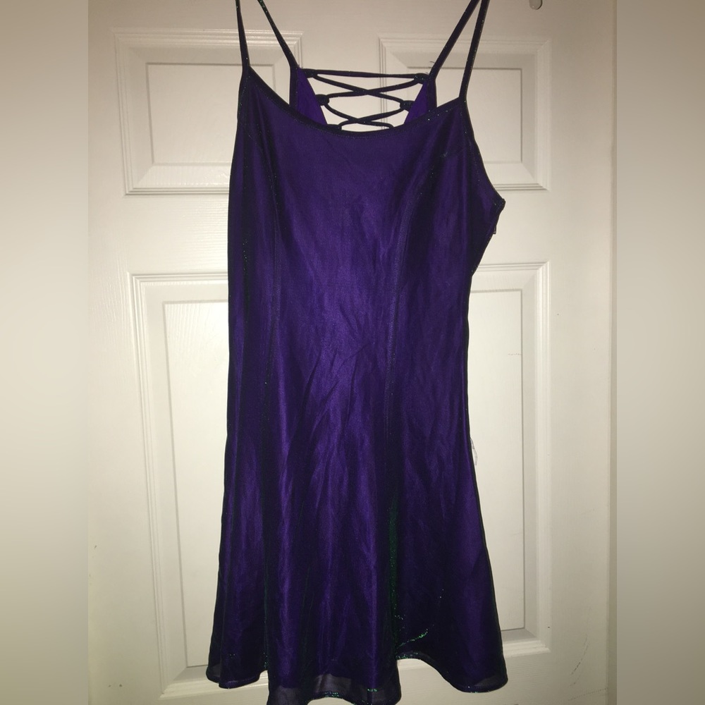 NWOT short lace up back iridescent dress. Size medium and beautiful.